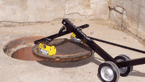 Magnetic tool safely lifts and removes manhole covers to reduce worker strain