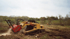 Remove trees and mulch material with attachment that fits skid-steer loaders