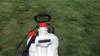 Hand-held sprayer holds one gallon of lawn chemicals for easy dispensing