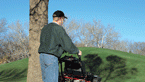 Instead of walking behind a mower, stand on stable platform
