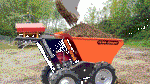 Motorized wheelbarrow hauls and dumps heavy landscaping materials