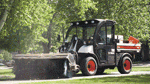 Vehicle combines loader, pickup truck, attachments