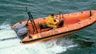 Inflatable, motorized boat rushes safely to rescue missions