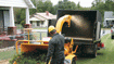 Towable wood chipper devours unwanted branches and brush