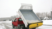 To dispense road salt, attach tailgate spreader to dump truck