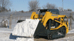 Squeeze compact track loader into tight spaces