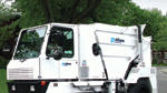Street sweeper’s sound-suppressed cab offers wide visibility for driver