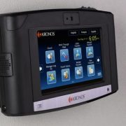 A wall-mounted Kronos InTouch time clock